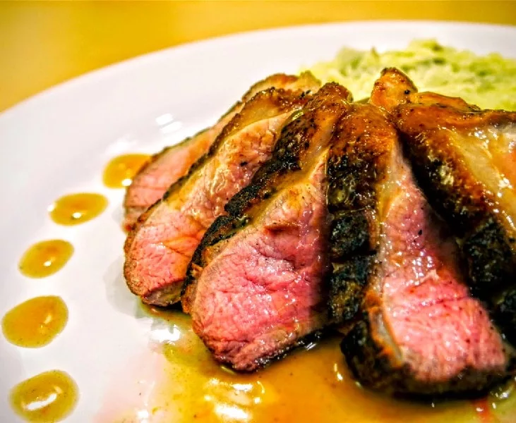 The Four Seasons Crisp Duck With Orange Sauce And Fig Garnish